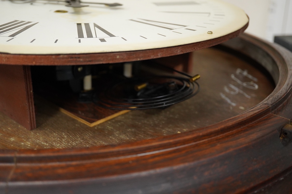 A large 20th century wall clock with platform escapement, the dial painted with GWR, 68cm in diameter
